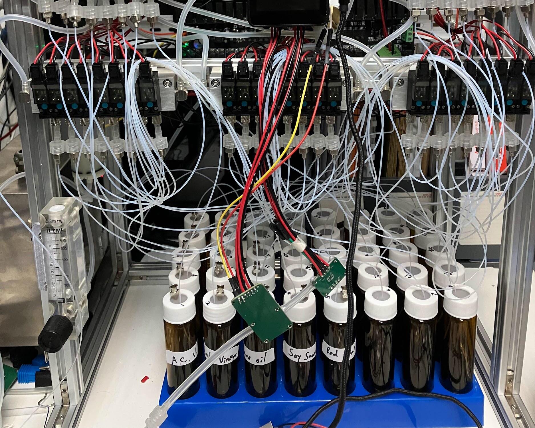 Multi-channel MEMS gas testing rig with valves, tubing, flow control, and sample vials